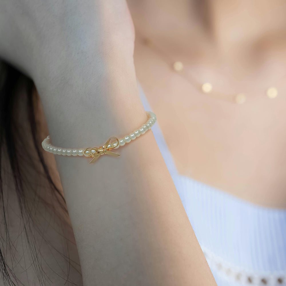 Dainty Pearl Stretch Bracelet with Gold Bow Charm
