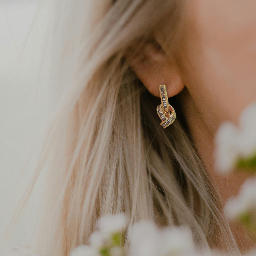 Elegant Twisted Drop Earrings with Baguette Accents